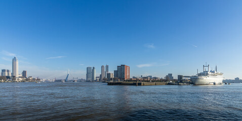 City landscape Rotterdam, with tall buildings the Erasmus Bridge the SS Rotterdam and the Zalmtoren