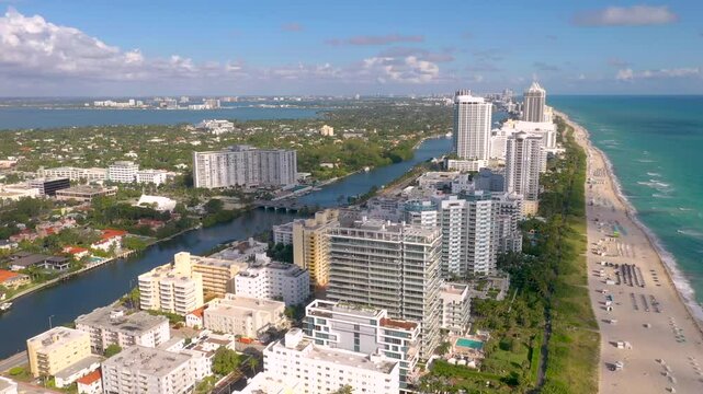 MIAMI, UNITED STATES - FEBRUARY 8, 2025: Beautiful aerial view of Miamis coastline with modern buildings and clear blue skies