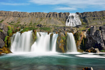 Waterfalls and mountains in the beautiful Icelandic landscape