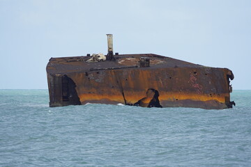 Fototapeta premium The shipwreck Mara Hope, an oil tanker, in the green ocean near Fortaleza Ceará, Brazil.