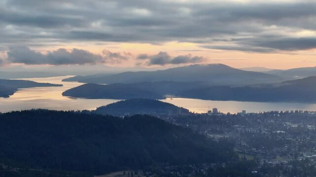 Aerial view of Coeur d Alene Idaho and adjacent communities at sunset during winter