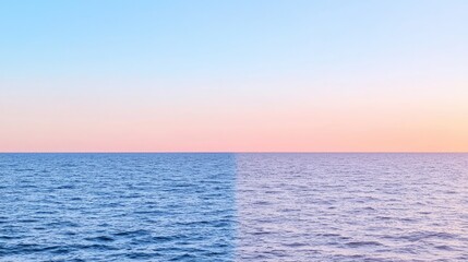 Fototapeta premium Two-toned sunset over calm water. Suitable for backgrounds and nature-themed designs