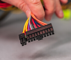 close-up of atx power supply connector with multicolored wires.