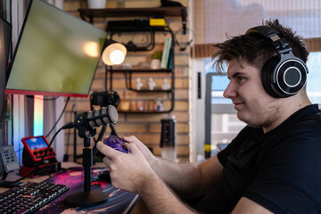 Professional gamer streaming live, playing videogames competitively at home