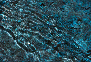 Moving water forming small standing waves on the Surface due to interference