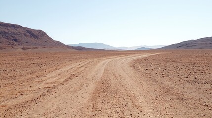 Naklejka premium Desert road winding through mountains