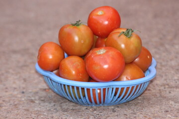 Fresh Tomatoes in a Plastic Basket