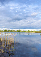 Lake with a cloudy sky in the background