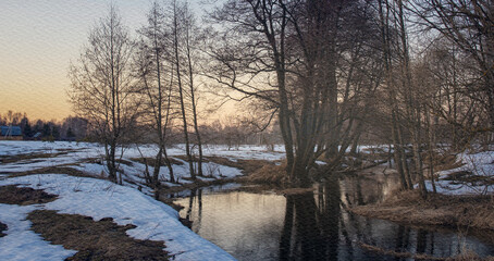 Snowy field with a river running through it