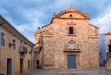 Fototapeta premium Old church in Montesa town, on a cloudy morning day.
