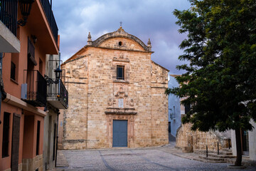 Old church in Montesa town, on a cloudy morning day.