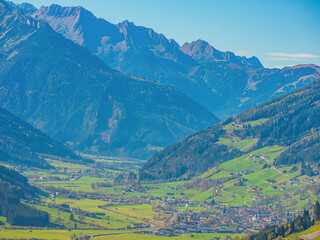 bright autumn landscape, view of the Austrian Alps. road to Italy on sunny day.