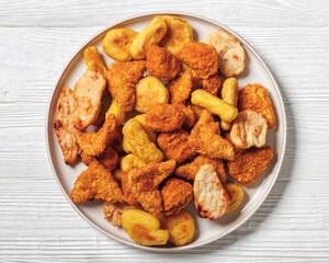 fried chunks, bites, tenders, nuggets on a plate