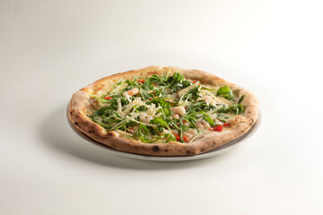 delicious pizza margherita with arugula, bresaola, parmesan and mozzarella on white background - valtellinese