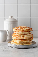 Homemade pancakes on white kitchen table background. Pancake day traditional meal