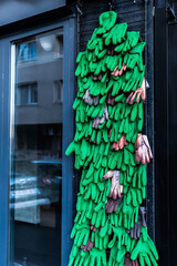 Wall of green gloves, showcase with gloves.