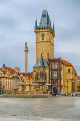Prague, Prague, Czech Republic. Historic Marian Column with baroque statues and Gothic tower.
