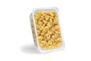 Close-up studio shot of an open plastic pack full of fresh Italian tortellini. Pack shot of transparent plastic box on white background