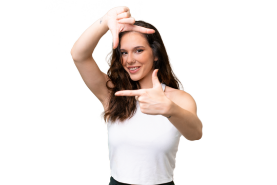 Young caucasian woman isolated over isolated background focusing face. Framing symbol