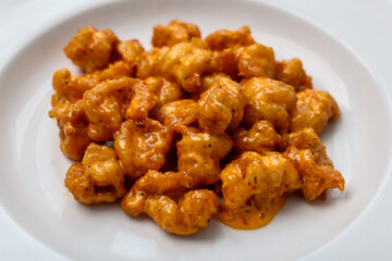 Up close photo of fried shrimp with sauce