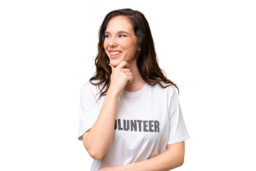 Young volunteer caucasian woman over isolated background looking to the side and smiling