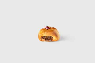 A delicate, golden uccellato, a traditional Sicilian pastry filled with sweet ricotta, perfectly shaped and set against a clean white background, ready to delight with its authentic flavor.