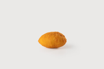 A golden, crispy arancino filled with delicious savory stuffing, perfectly shaped and placed on a clean white background.