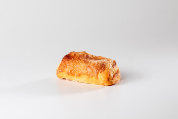 A delicate, flaky pastry filled with smooth ricotta cheese, capturing the simplicity and richness of this classic Sicilian or italian treat in a close-up shot.
