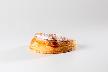 A delicate, flaky pastry filled with smooth ricotta cheese, capturing the simplicity and richness of this classic Sicilian or italian treat in a close-up shot.