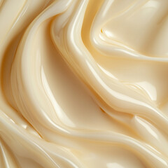 Obraz premium Smooth, creamy texture with soft, flowing folds in a light beige tone. A close-up of a glossy, silky substance creating organic curves and waves