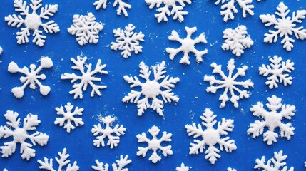 White snowflakes scattered on a blue background