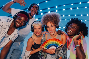 Friends listening to music at silent disco, enjoying party together