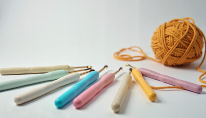 Detailed crochet hooks in different colors, vibrant mood, crafting supplies on a clean background, with copy space