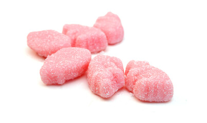 Gummy pigs shaped cutter, isolated in glass bowl on white background