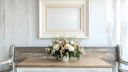 A French country-style dining space with a floral centerpiece and a white frame above a distressed wooden bench.