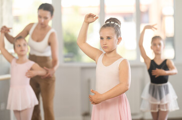 Ballet choreographer teaches little girls to get into first position © JackF
