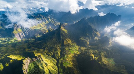 Fototapeta premium Aerial view of a stunning mountain landscape, showcasing towering peaks and rugged terrain. 