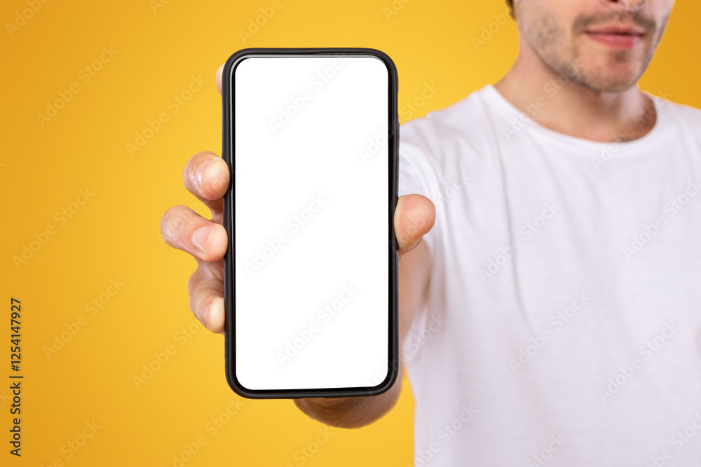 Poster trendy mobile phone. closeup of bearded male holding smartphone with white empty screen in hand, sho