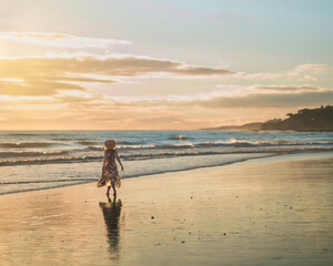 Woman on the sunset beach