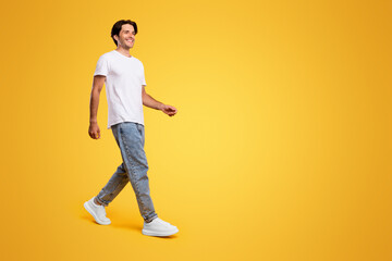 Advertising And Marketing. Full length body size profile side view of nice cheerful bearded guy in...