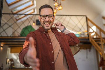 Portrait of one man happy caucasian male with travel bag at his house