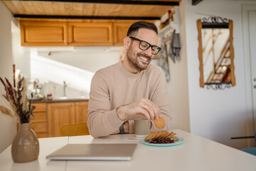 Adult caucasian Man Enjoy Breakfast at Home with Jam and Biscuit