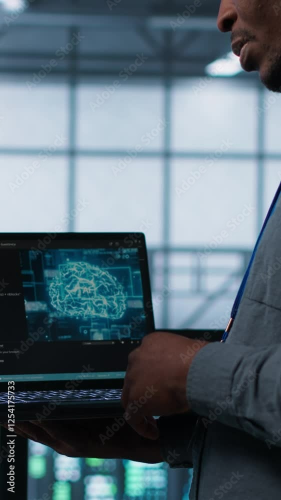 Poster vertical video software developers using ai tech on laptop in data center managing server virtualiza