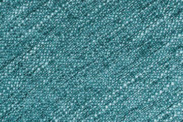 Turquoise Jacquard fabric with large loose diagonal woven, coarse weave texture upholstery cloth. Textile background, furniture textile material, wallpaper, backdrop. Cloth structure close up, macro.