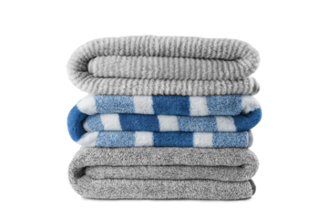 Soft fluffy striped grey and blue bath towels folded in stack isolated on white, transparent background. Terry cloth, striped pattern towel texture, cotton textile microfiber beach towel material