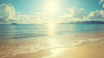 Obraz premium A relaxing beach with bright sunlight reflecting off calm ocean waves.