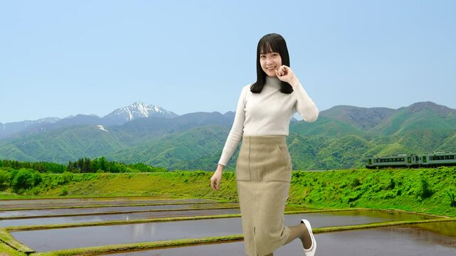 観光地で記念撮影ポーズをとる女性