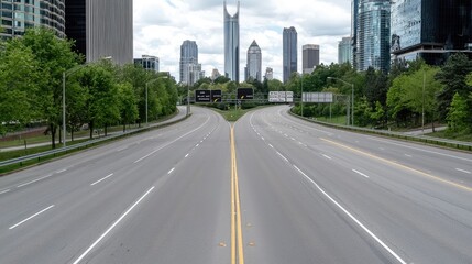 Fototapeta premium Empty highway in city, cityscape in background, possible use for travel, or urban planning