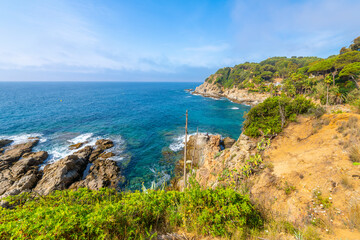 View of the Mediterranean sea and coast of Costa Brava from the Cala Banys nature walk trail and...
