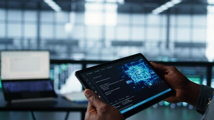 Programmer in data center using AI tech on tablet, testing equipment failover scenarios. Server farm IT specialist uses artificial intelligence on device, ensuring data accessibility, camera B closeup